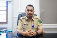 Plt Kepala Bapenda T. Robi Chairi saat dikonfirmasi di kantor Bapenda Kota Medan, Senin (26/5/25).