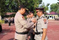 Kapolres Langkat, AKBP David Triyo Prasojo SH, SIK, memimpin upacara serah terima jabatan (Sertijab) sejumlah pejabat utama Polres dan Kapolsek jajaran di halaman Mapolres Langkat, Kamis (31/07/2025).