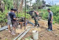 Pembangunan sumur bor oleh Satuan Tugas TNI Manunggal Membangun Desa (TMMD) ke-127 Kodim 0207/Simalungun bersama warga, pada Sabtu, 14 Februari 2026.