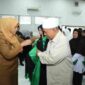 Wakil Wali Kota Pematangsiantar, Herlina, saat memakai toga sebagai simbol dewan Hakim MTQ. 