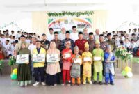Wakil Bupati Asahan menghadiri khitan massal dan penyaluran ZIS BAZNAS Asahan.