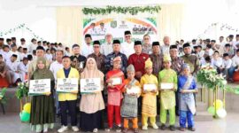 Wakil Bupati Asahan menghadiri khitan massal dan penyaluran ZIS BAZNAS Asahan.