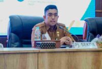 Penjabat Sekretaris Daerah (Pj. Sekda) Kota Medan Erfin Fahrurrazi pada kegiatan Evaluasi Parameter dan Dokumen Pendukung Innovative Government Award (IGA) 2026 di Ruang Rapat 3, Lantai 4 Kantor Wali Kota Medan, Selasa, 18 Agustus 2026.