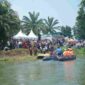 Bupati Asahan Taufik Zainal Abidin membuka Festival Sungai Asahan 2026 dengan penanaman pohon, tebar benih ikan, lomba dan kegiatan UMKM.