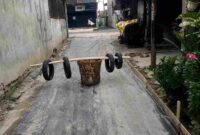 Kondisi jalan yang telah direhab dengan rabat beton.