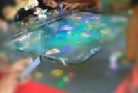 Mesin permainan tembak ikan.