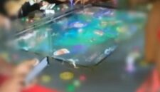 Mesin permainan tembak ikan.