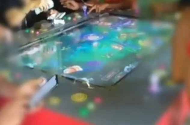 Mesin permainan tembak ikan.
